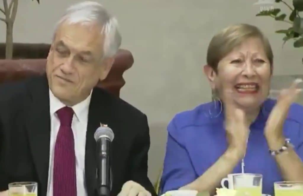 Mujer eufórica en desayuno de Piñera es militante RN y excandidata a concejal